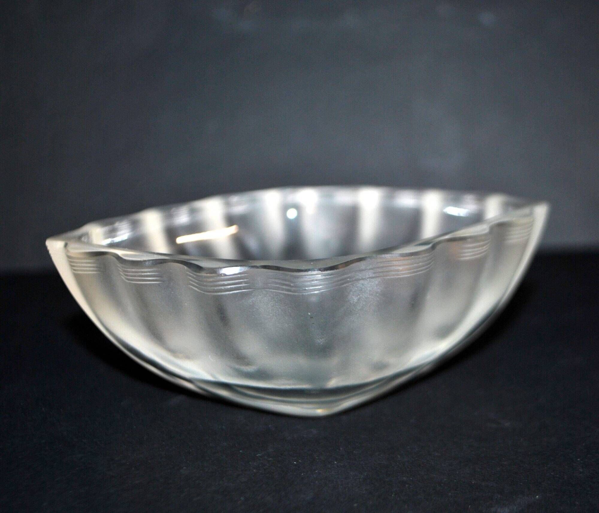 Lalique glass ashtray bowl with frosted finish, engraved with wave design, signed Lalique.