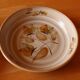 Four bowl-shaped plates in vintage Niderviller stoneware with plant decoration