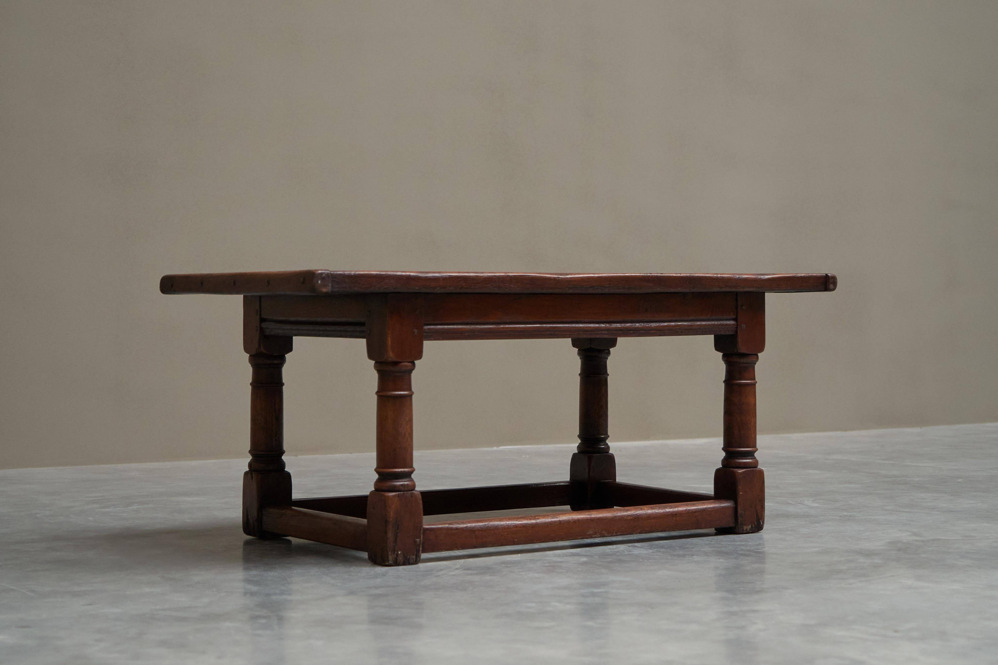 Antique solid oak coffee table in refectory style, 19th century.