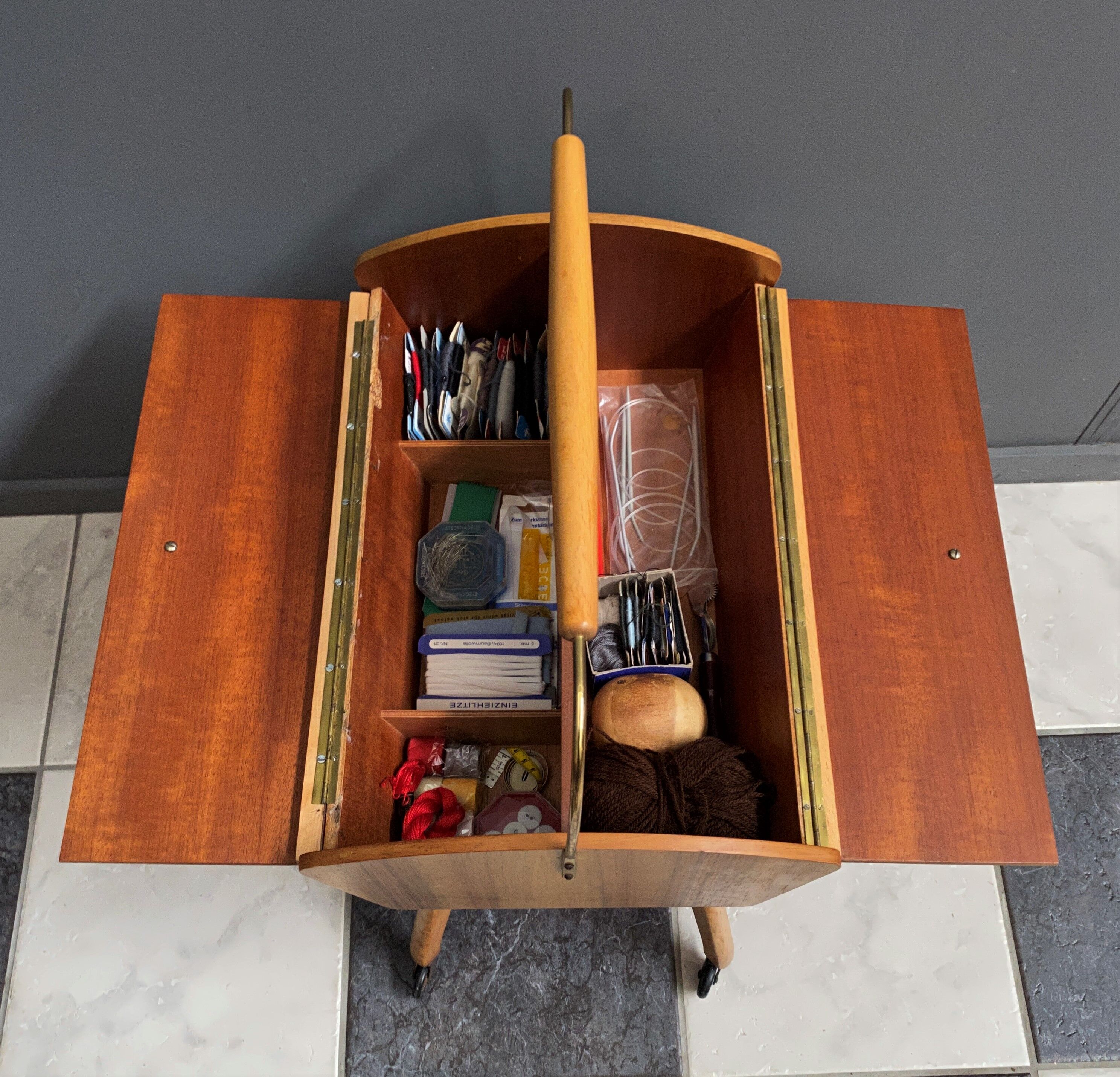 Sewing box on legs and wheels