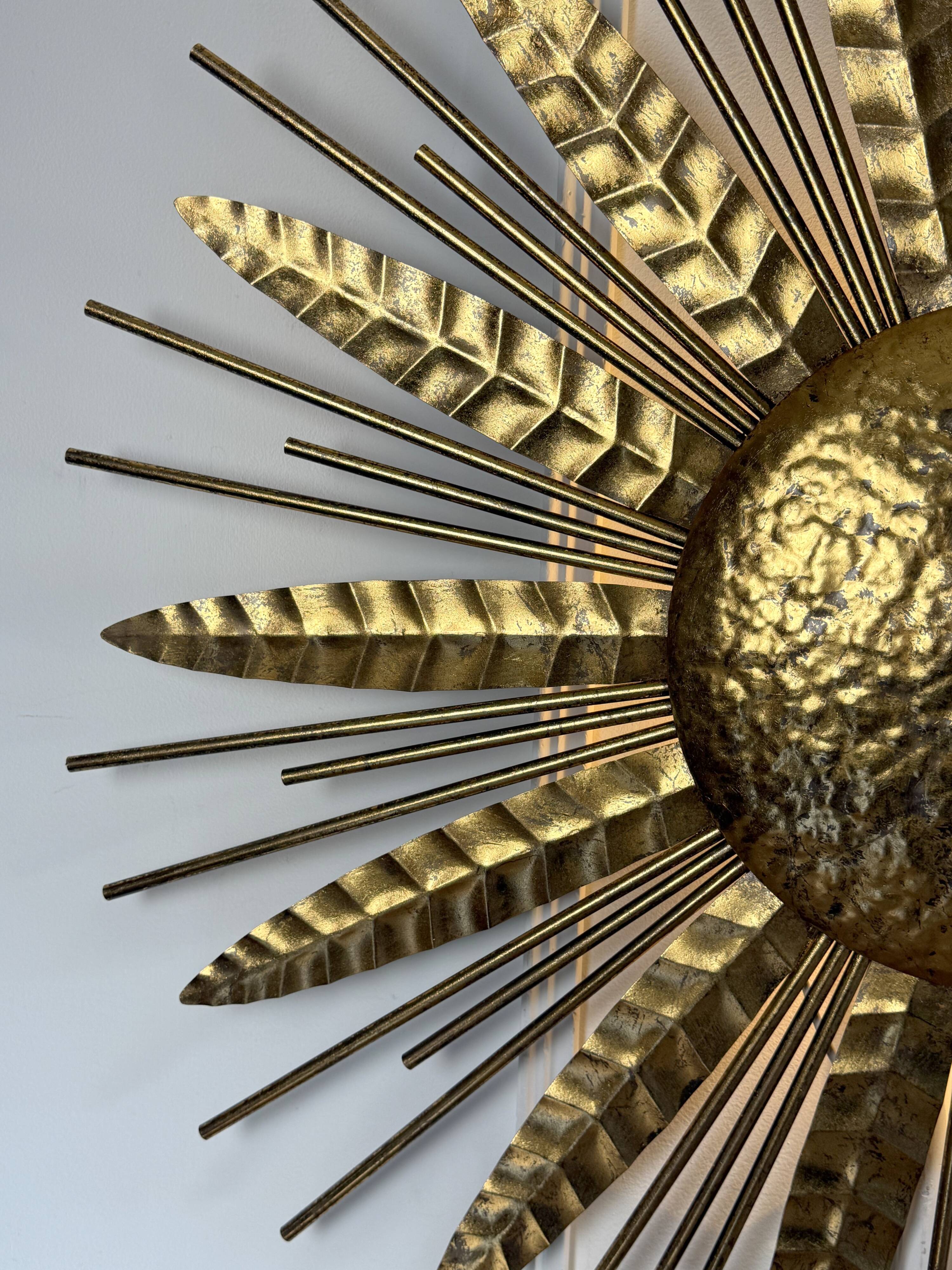 Large golden hammered metal sun wall light with a diameter of 90 cm from the year