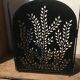 Wrought and cut metal fire screen
