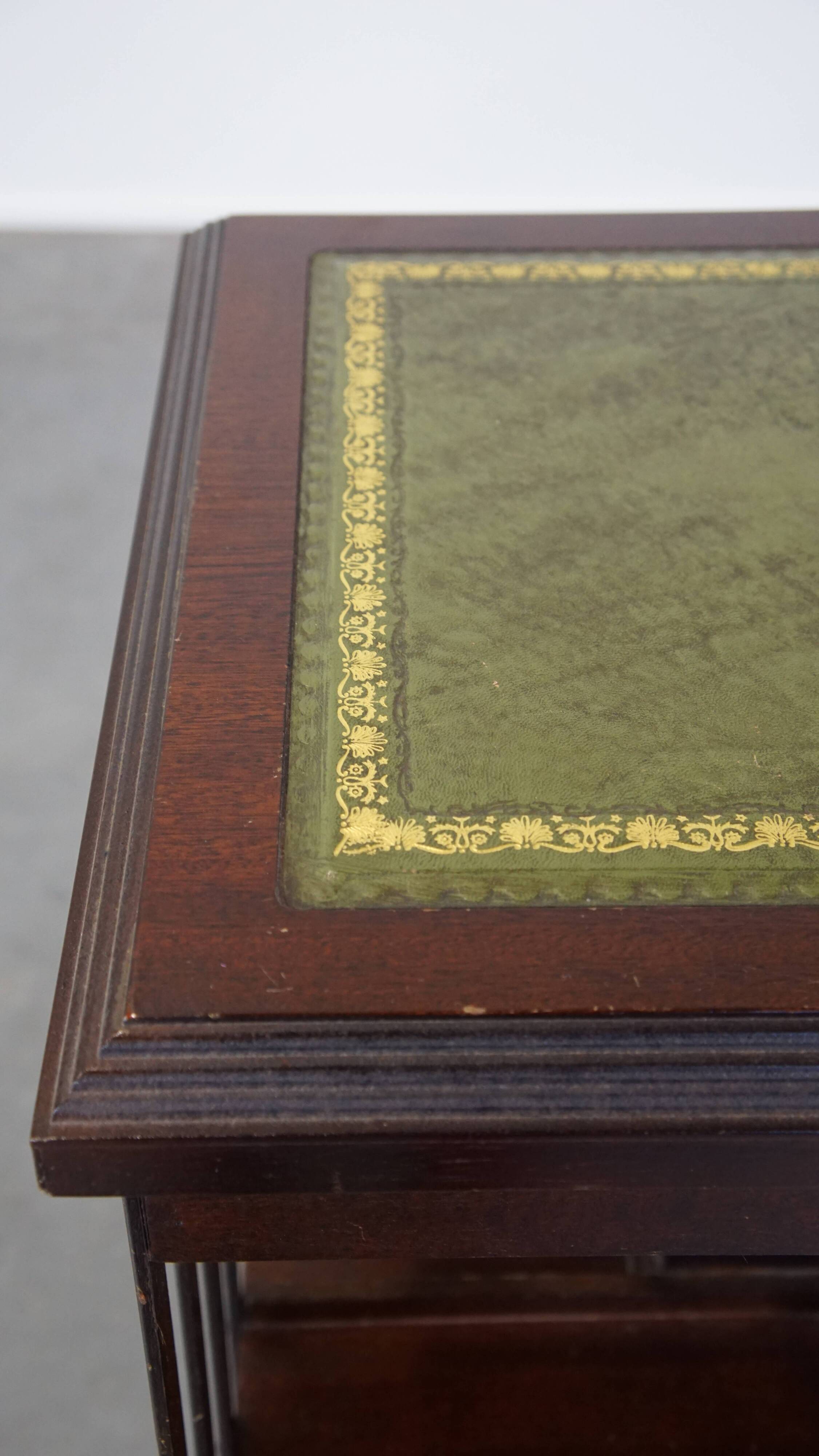Wooden bookstand with green leather surface and on wheels in English style