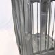 Old chandelier hanging lantern with candle in sheet metal