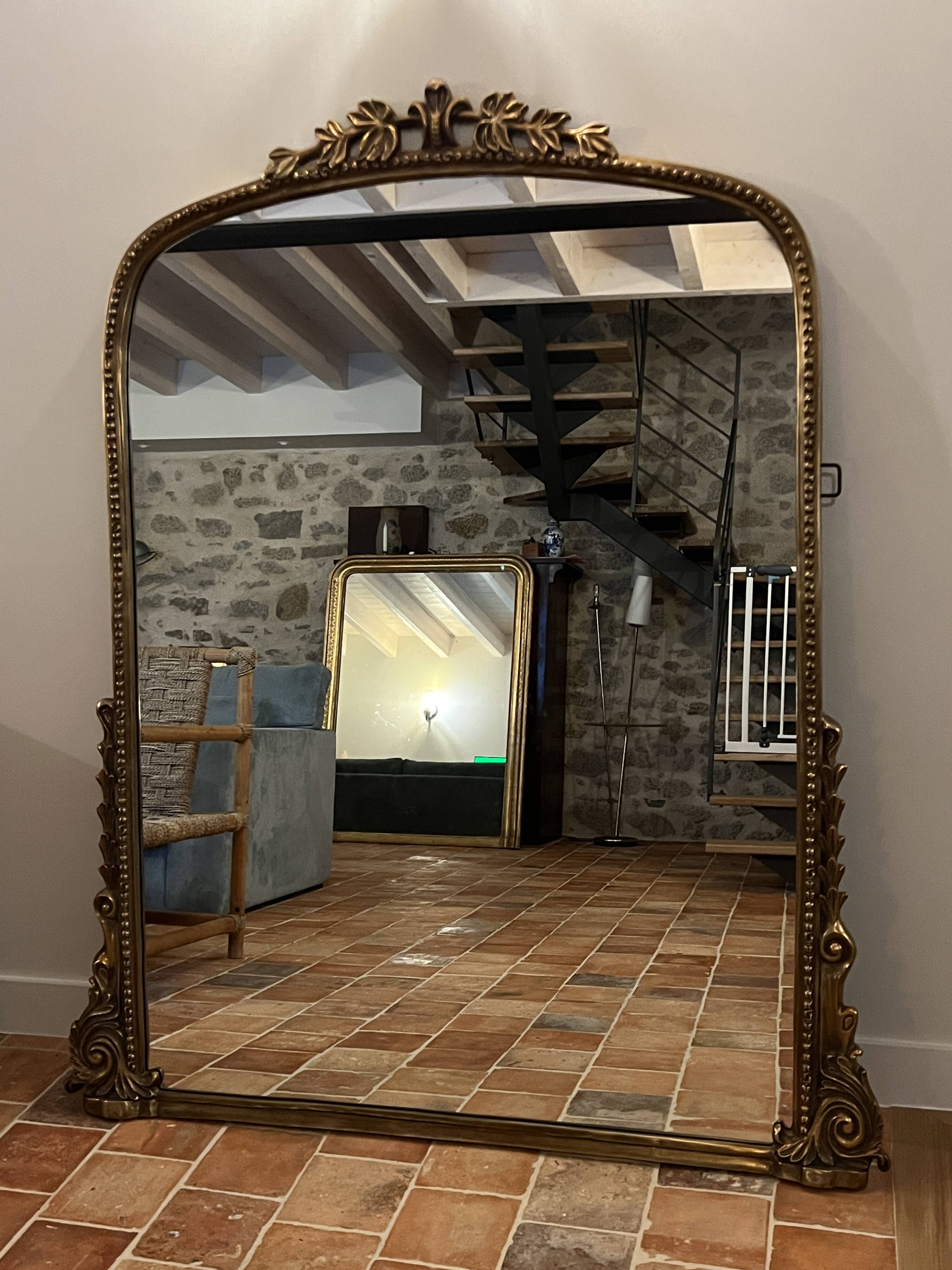 Large gilded mirror with pediment