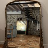 Large gilded mirror with pediment