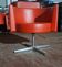 Fauteuil vintage en cuir orange, pied croix en aluminium Peter Maly pour Cor