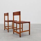 Pair of wood and leather Spanish chairs by Jordi Vilanova, ca. 1960