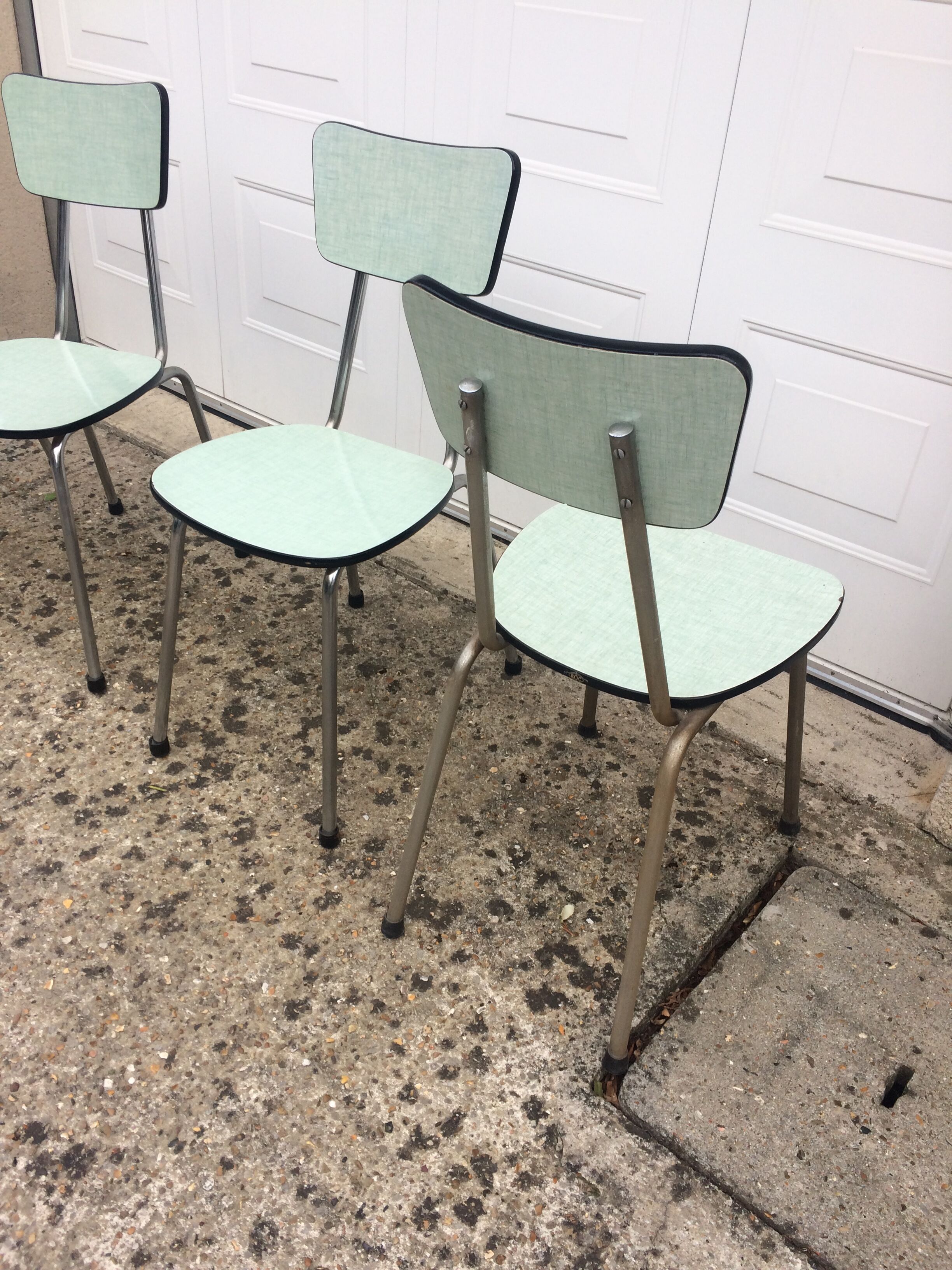 4 green formica chairs