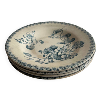 Lot de quatre assiettes creuses, terre de fer
