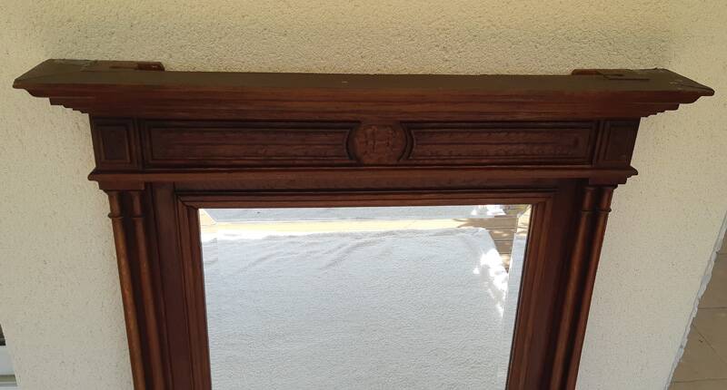 Henri II trumeau mirror for a fireplace in solid walnut.