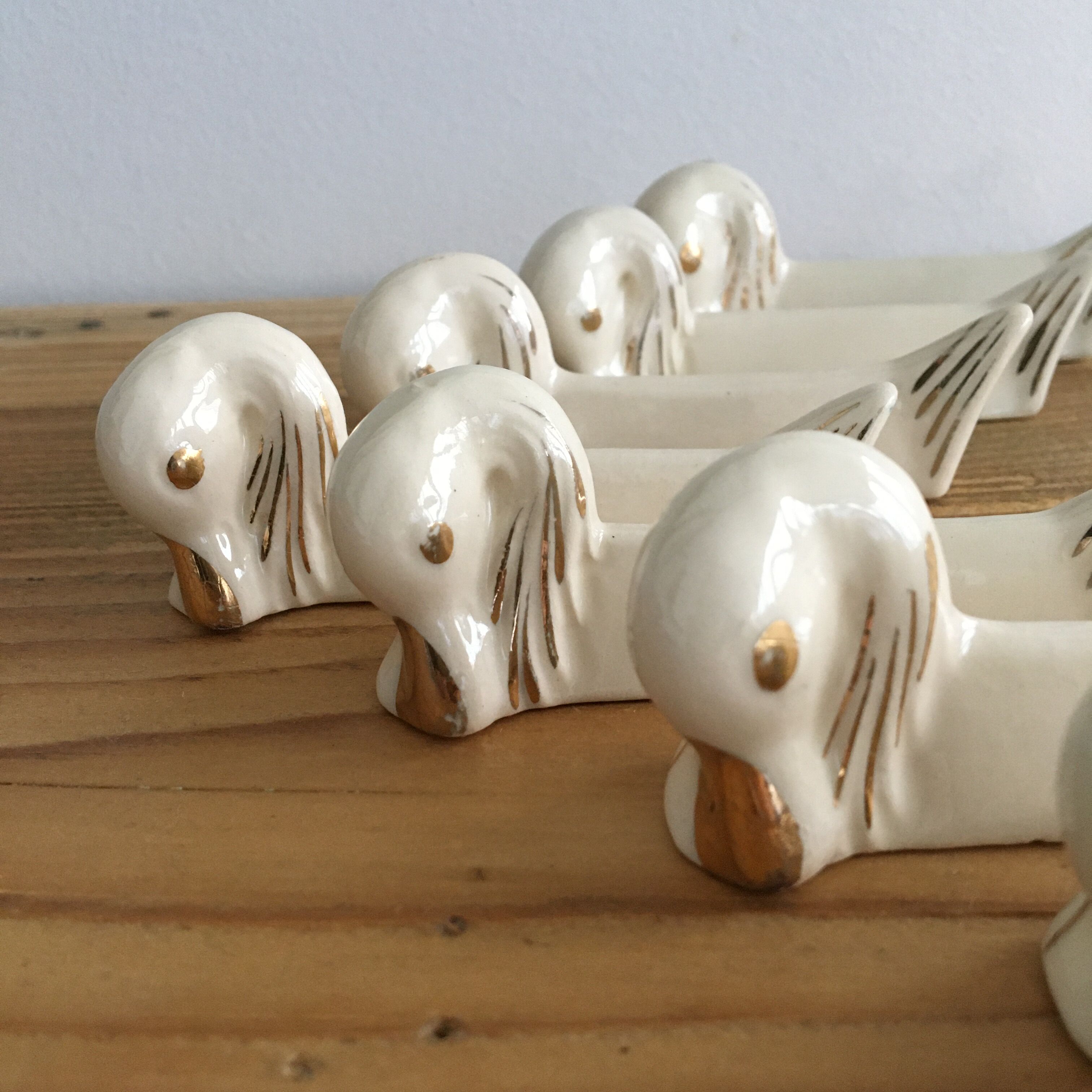 Set of 8 ceramic swan knife holders 50s