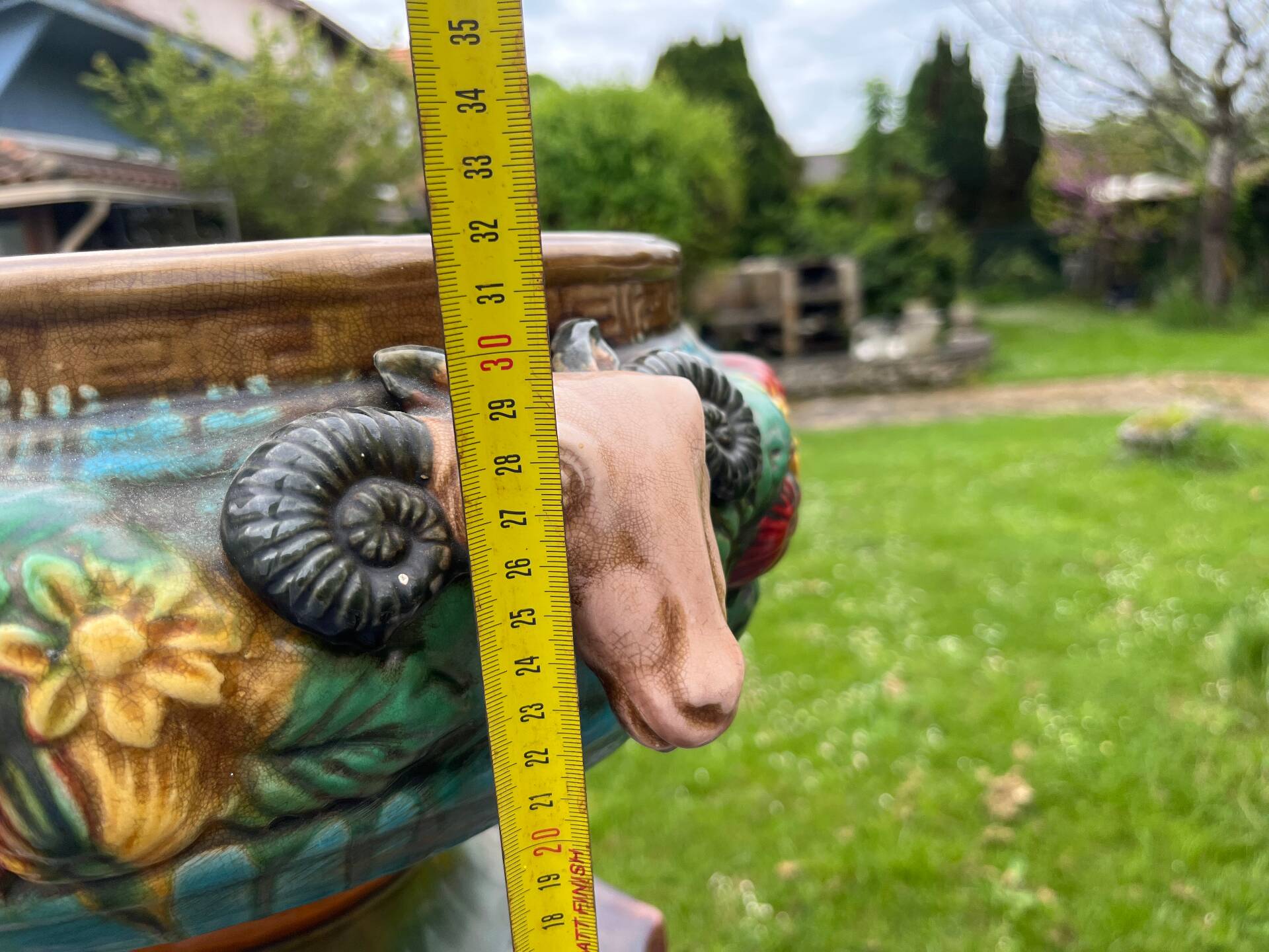 Large neoclassical majolica jardinière with ram's heads.