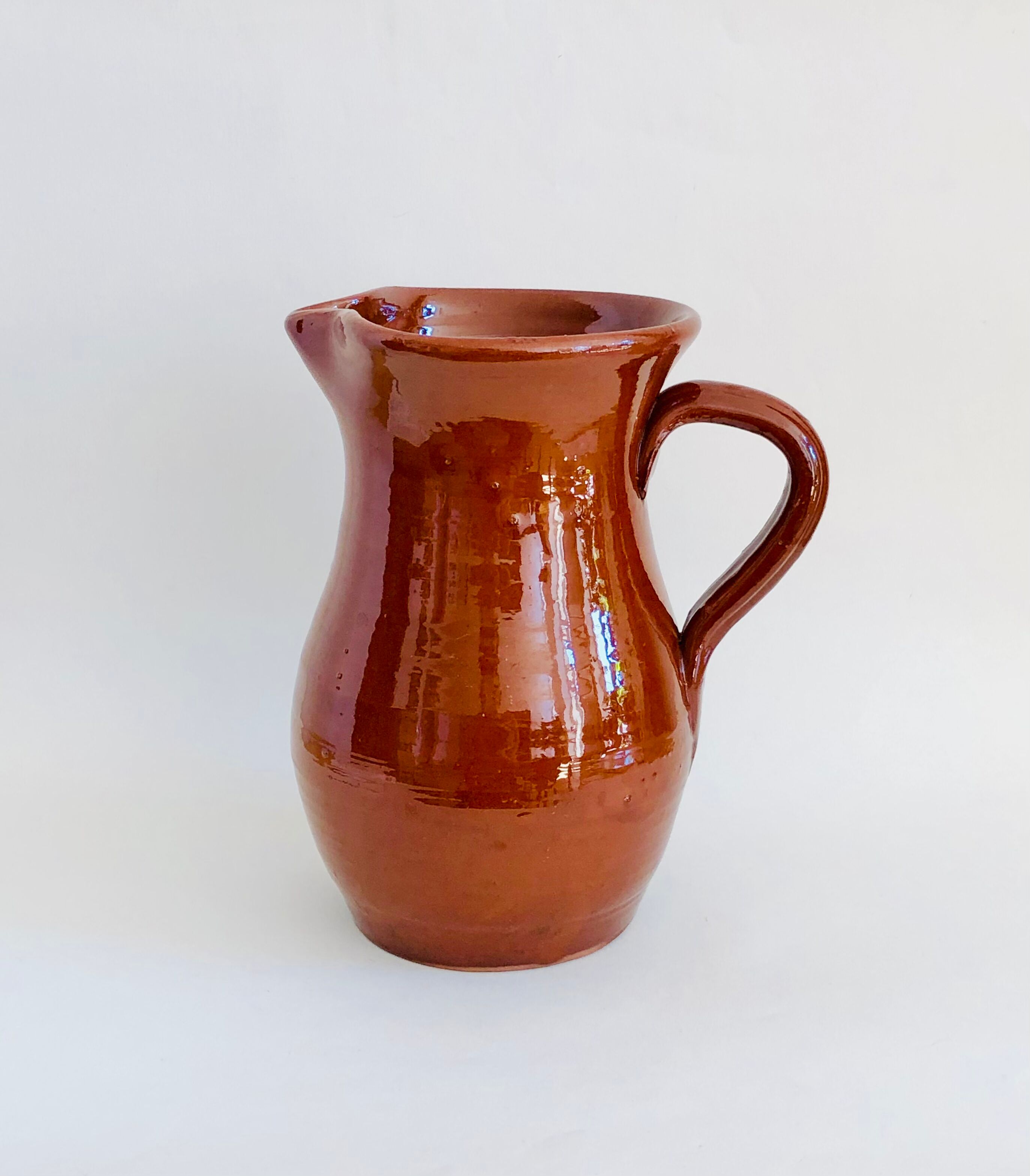 Vintage pitcher in glazed earth