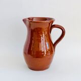 Vintage pitcher in glazed earth