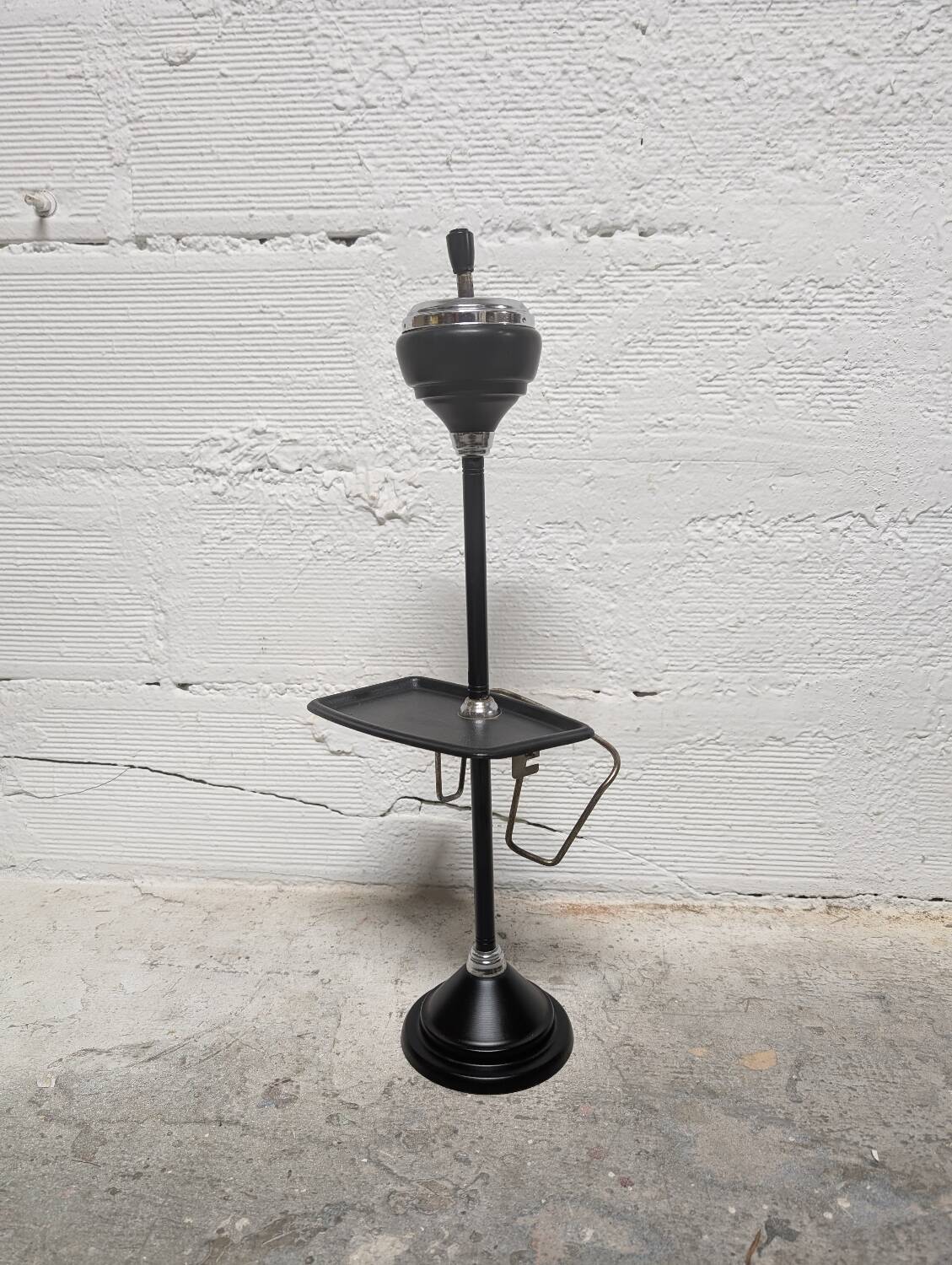 Standing ashtray with magazine rack