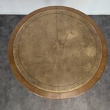 Louis XVI style dining table with a leather top.