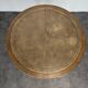 Louis XVI style dining table with a leather top.