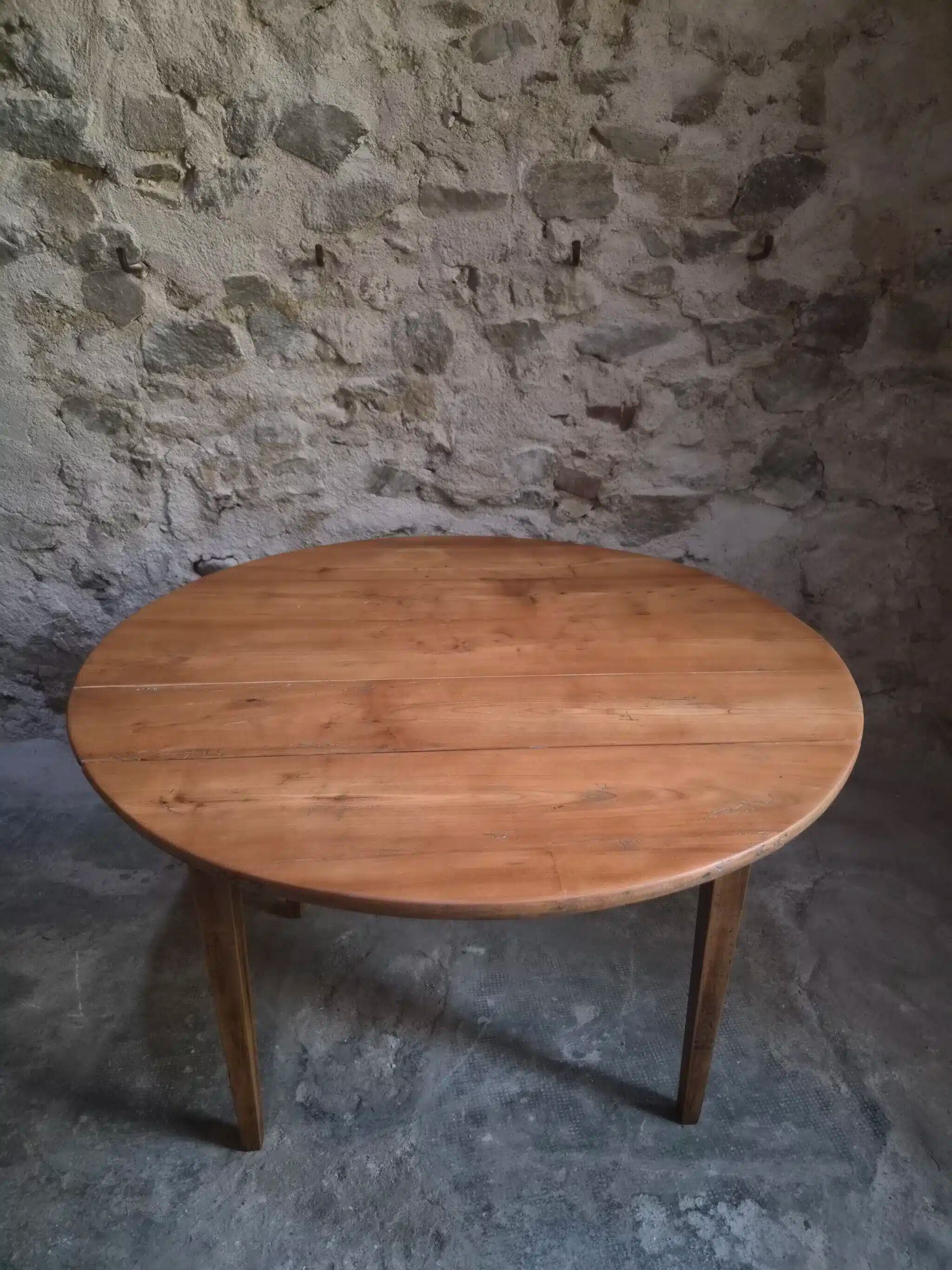 Rustic French antique dining table, drop-leaf table in cherry wood, circa 1900.