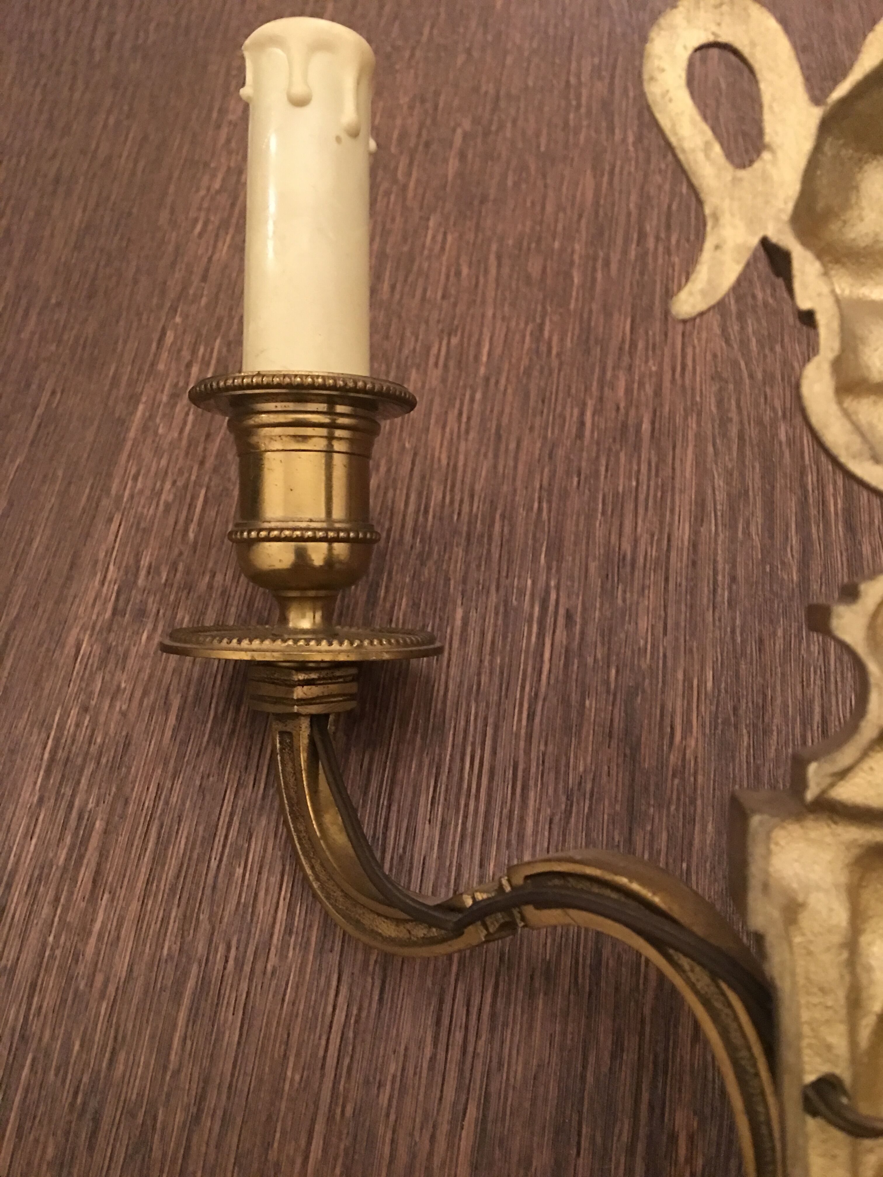 Eleven gilded bronze wall lamps
