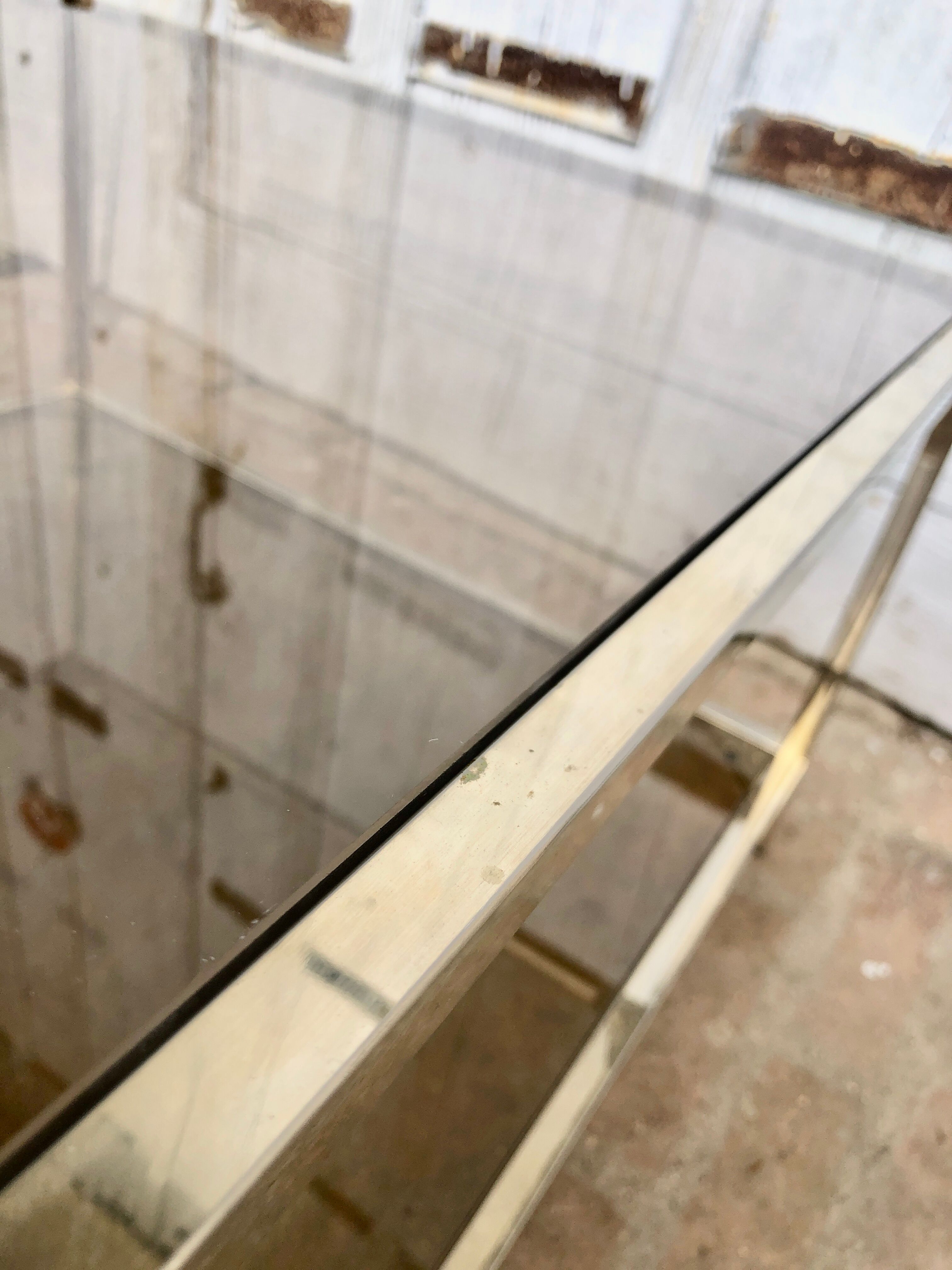 Square brass coffee table and smoked glasses