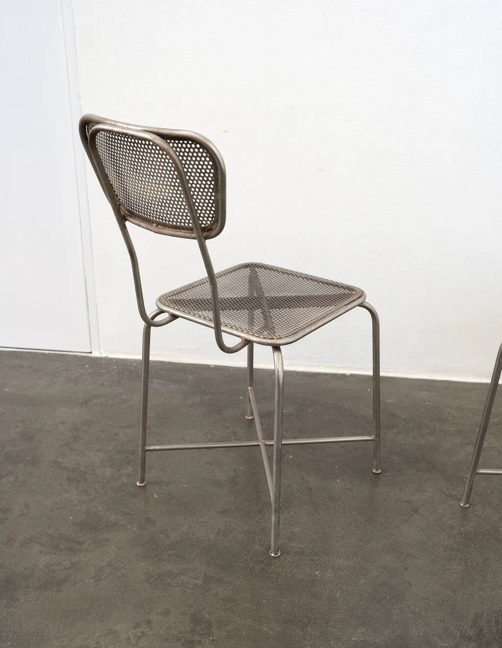 Vintage perforated metal chairs