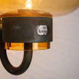 Pair of brass wall lamps with decorated amber coloured shades