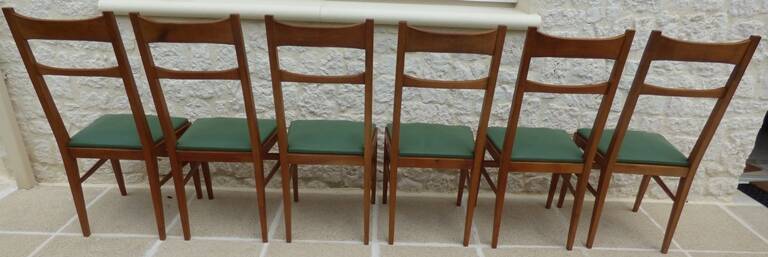 6 modern chairs with banded backs and green faux leather seats