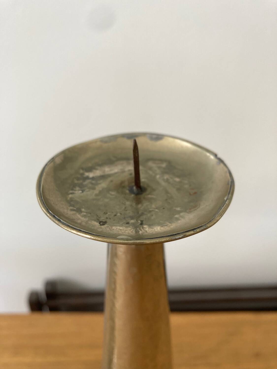 Pair of hammered metal candlesticks