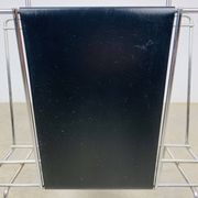 Chrome and black leather magazine rack, 1970s.