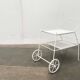 Mid-century modern minimalist perforated metal bar cart from the 1960s.