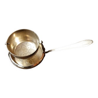 Silver metal tea strainer