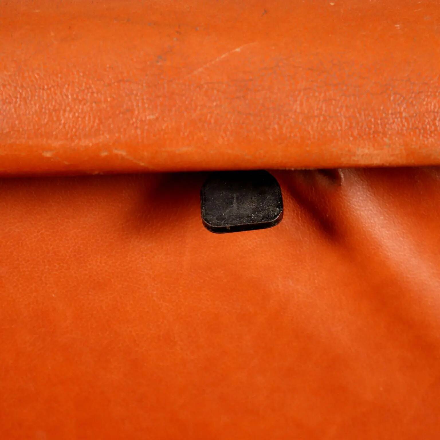 Vintage armchair from the 1970s in foam, faux leather, and metal.
