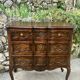 Carved and moulded solid wood commode in the Louis XV style.