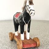 Old wooden pull-along toy, horse.