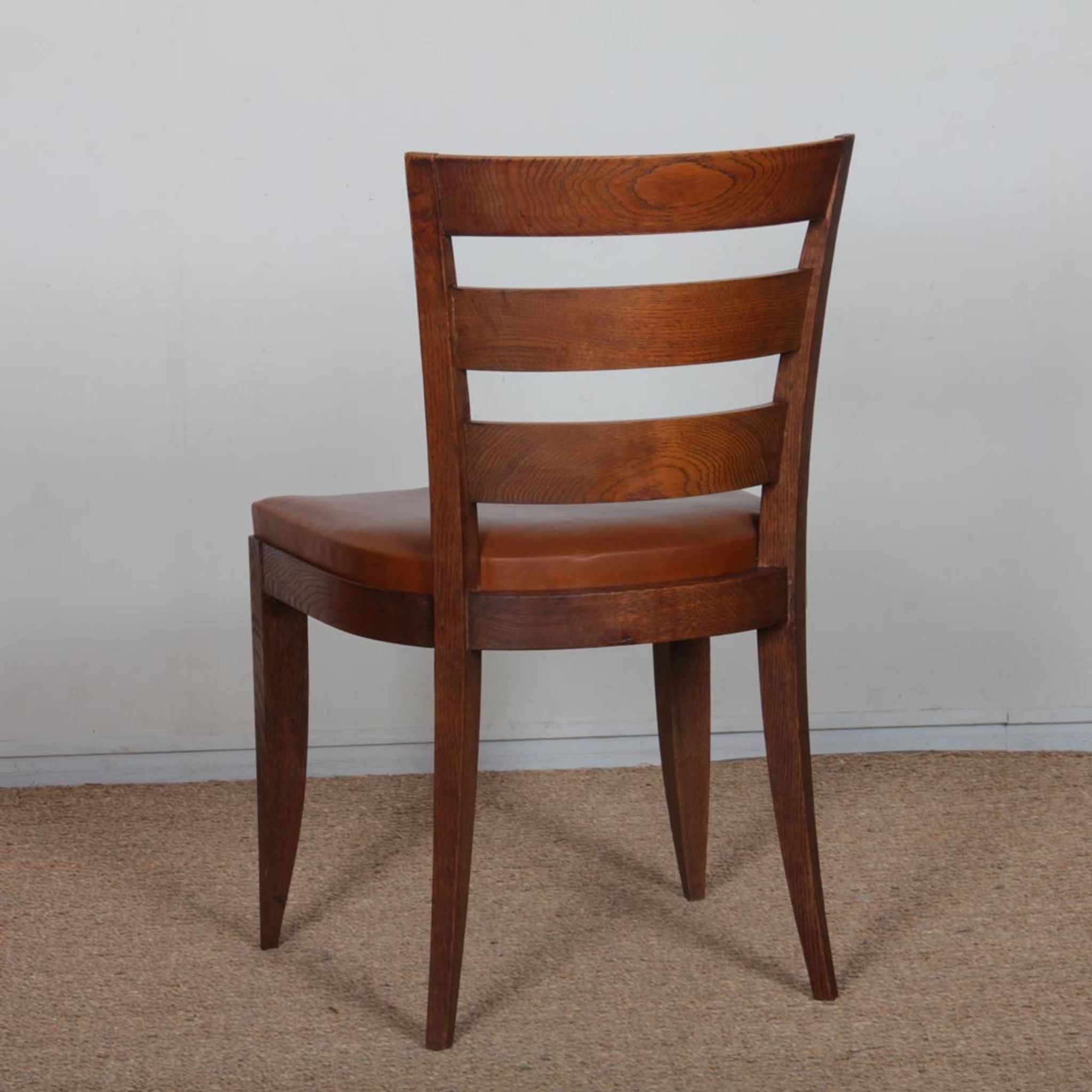 Set of 6 oak chairs in the style of Jean Pascaud, 1940.