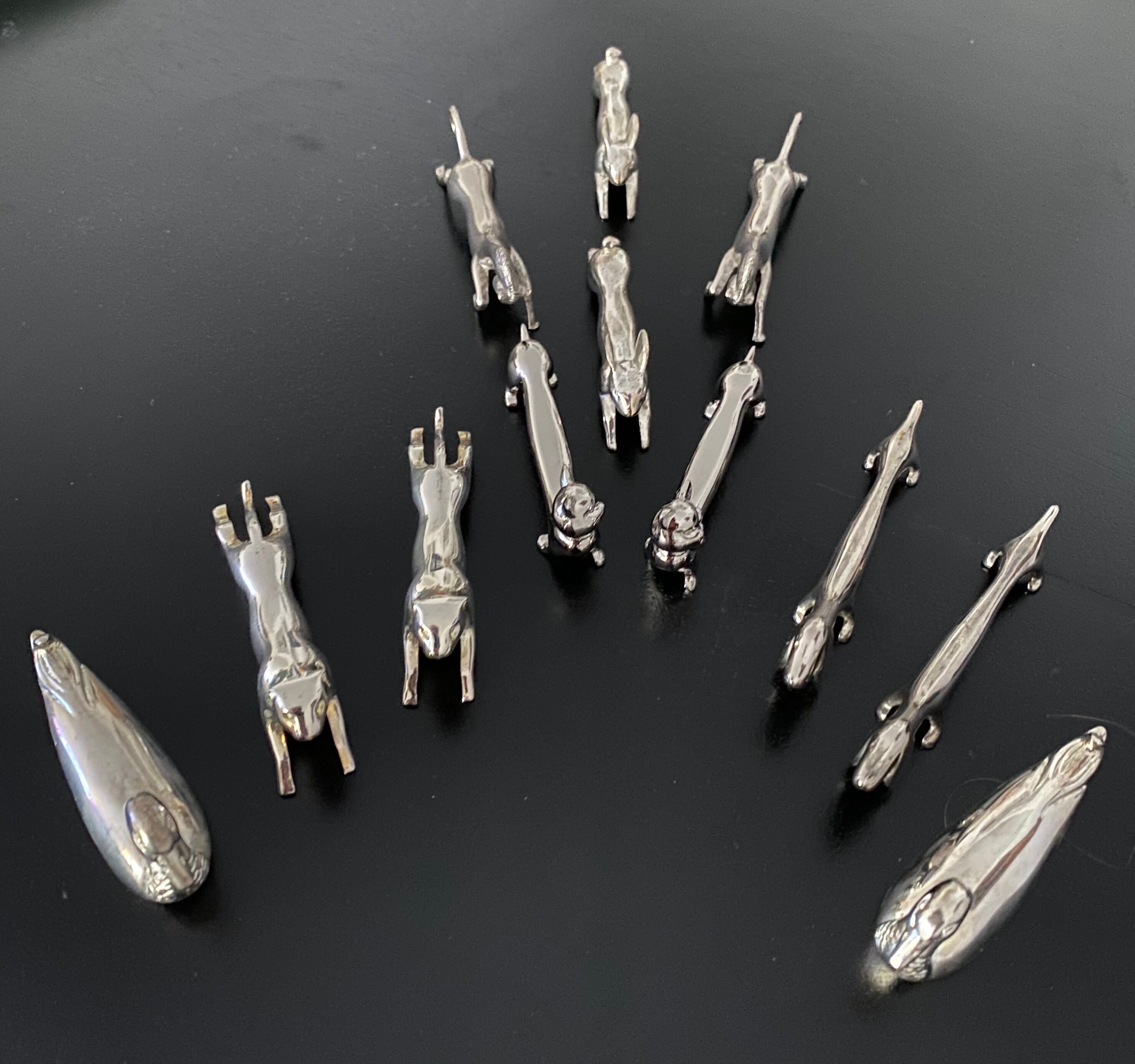12 knife holders form various metal animals