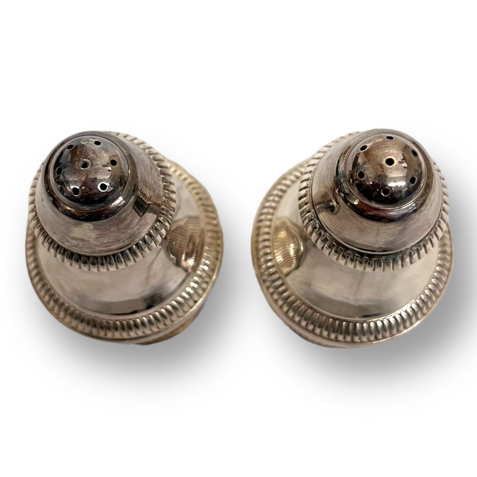 Salt shaker and pepper shaker in silver metal