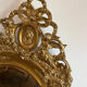 Large antique baroque mirror with angel decorations.