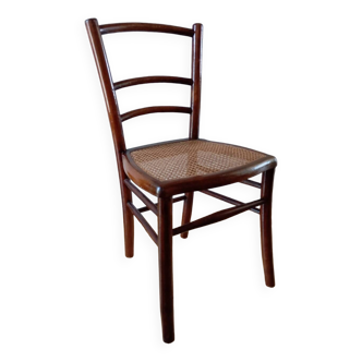 Wooden chair with cane seat, country style, circa 1920