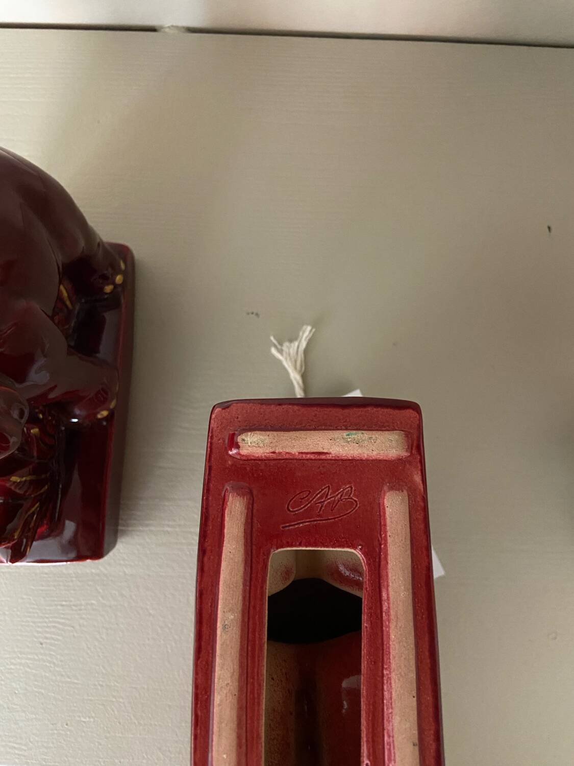 Pair of burgundy ceramic “Elephants” bookends