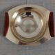 Plates and a brass and Bakelite cut by PM Italy, Italy around 1970.