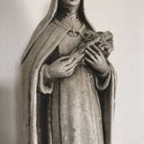 Religious statue of sainte therese of lisieux “the little flower of jesus” in stone