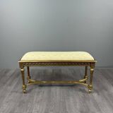 Antique gilded wooden bench in Louis XVI style, 19th century.