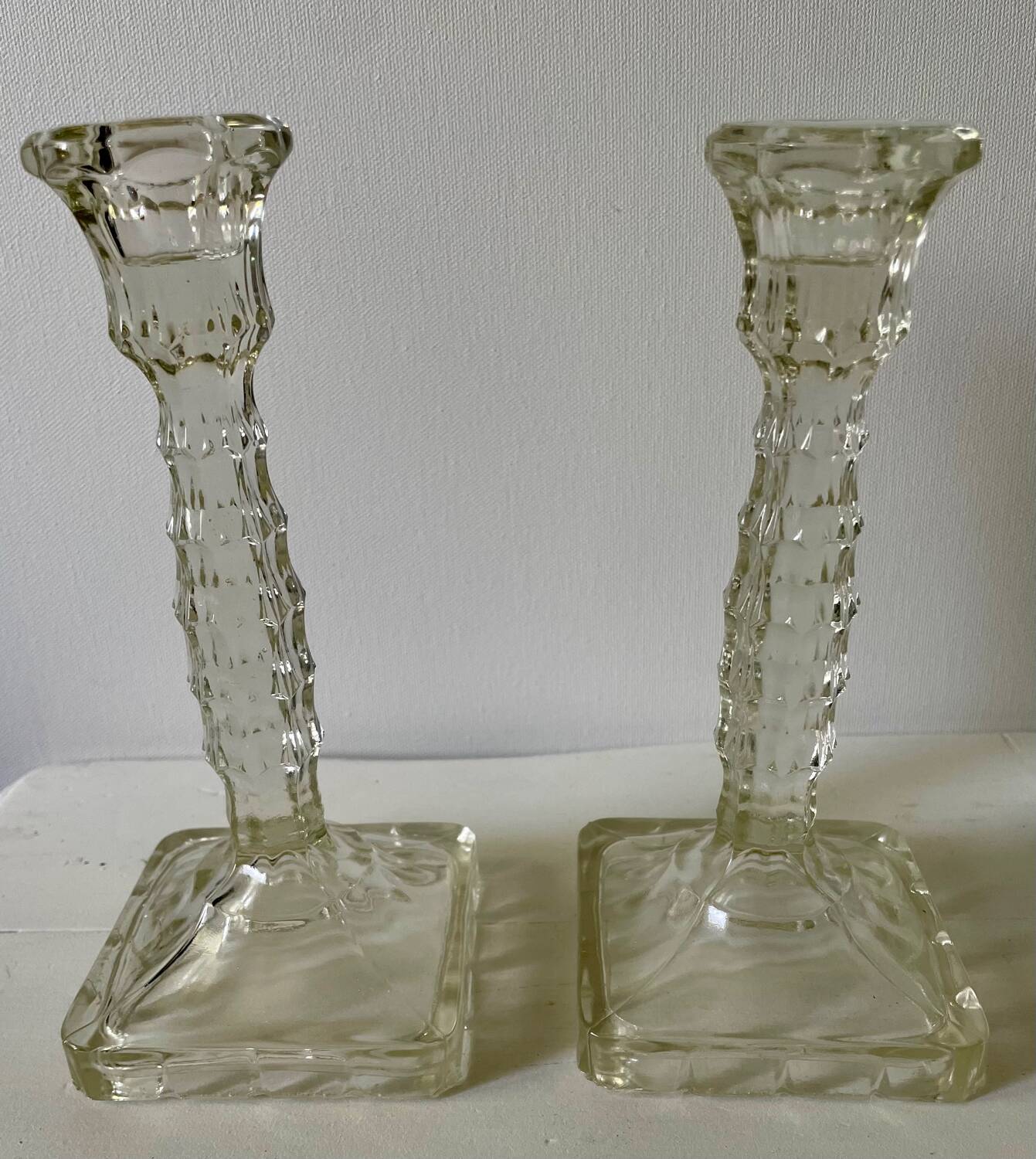 Pair of molded glass candlesticks