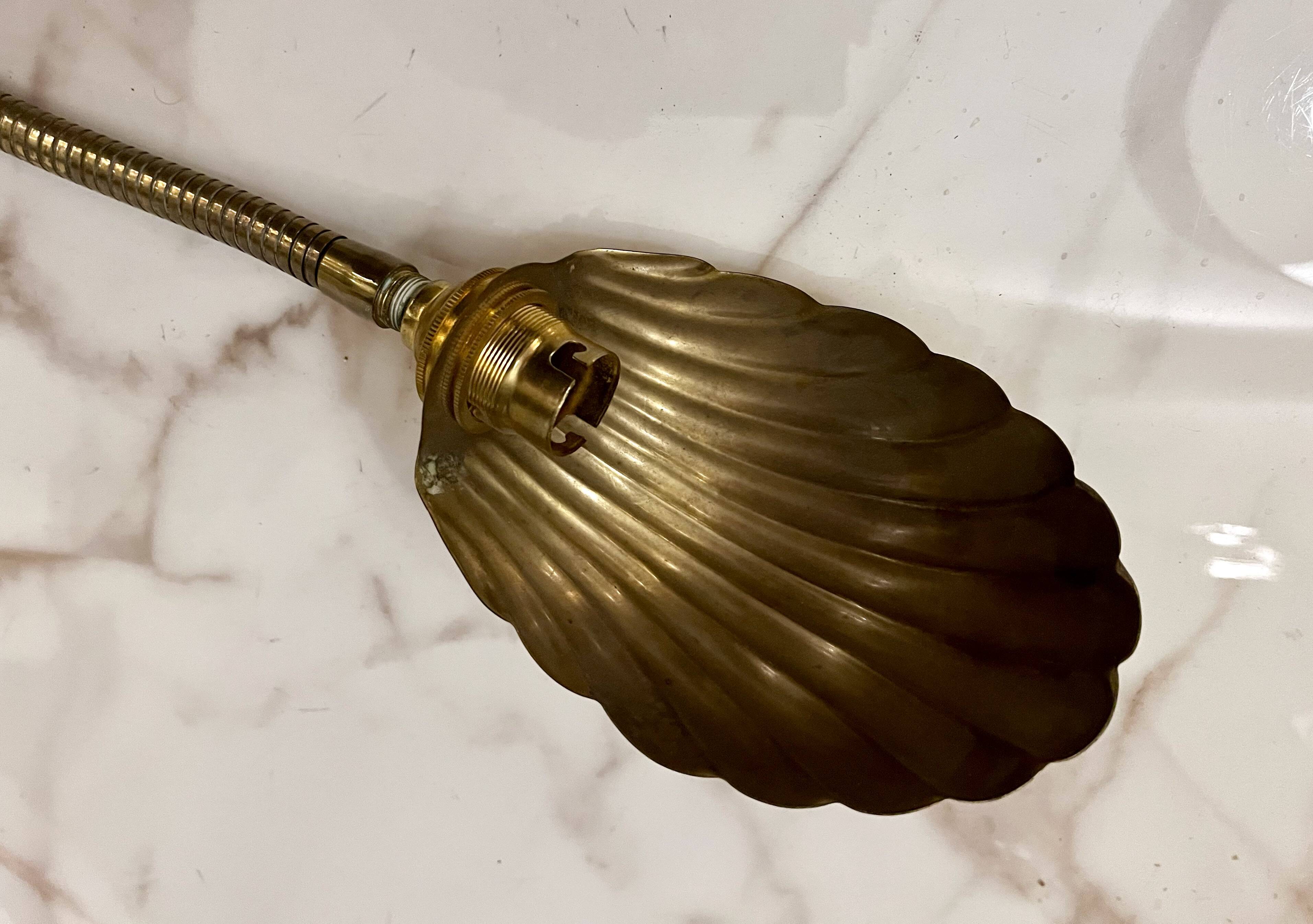 Articulated shell wall light
