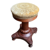 Adjustable piano stool in dark wood and embossed velvet.
