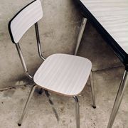 Table and 2 chairs set made of Formica.