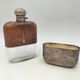 Silver-plated metal flask with leather and glass
