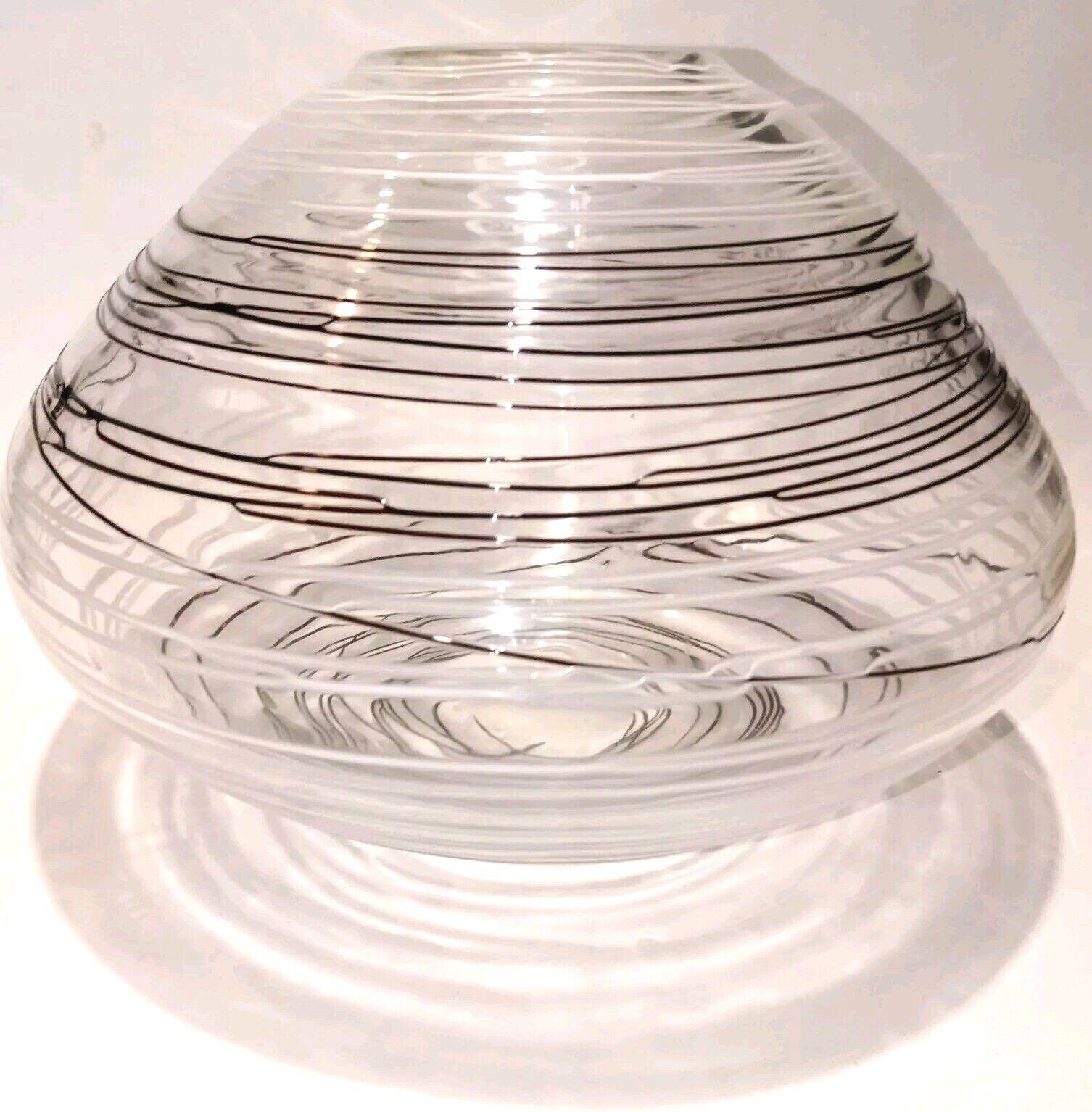 Textured oval blown glass vase with black and white glass spaghetti.